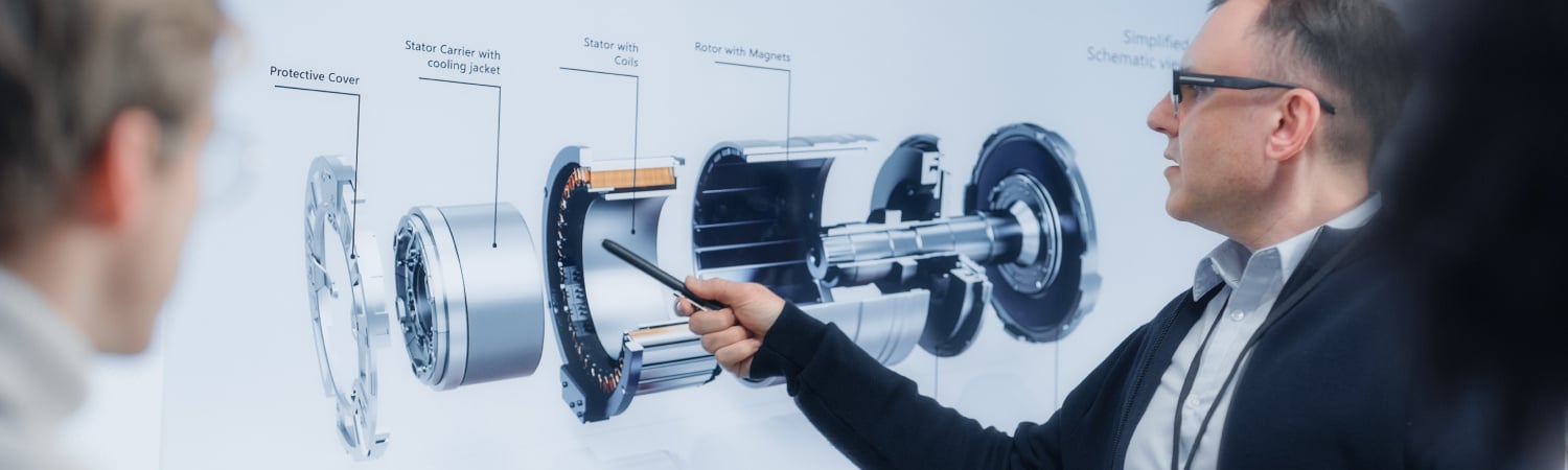 woman pointing at electric motor production design